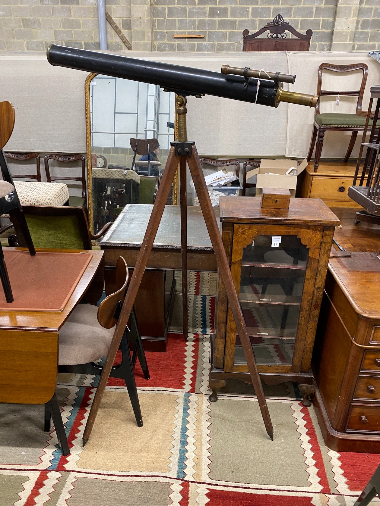 An early 20th century, Broadhurst and Clarkson astronomical telescope on folding tripod, the telescope length 110cm